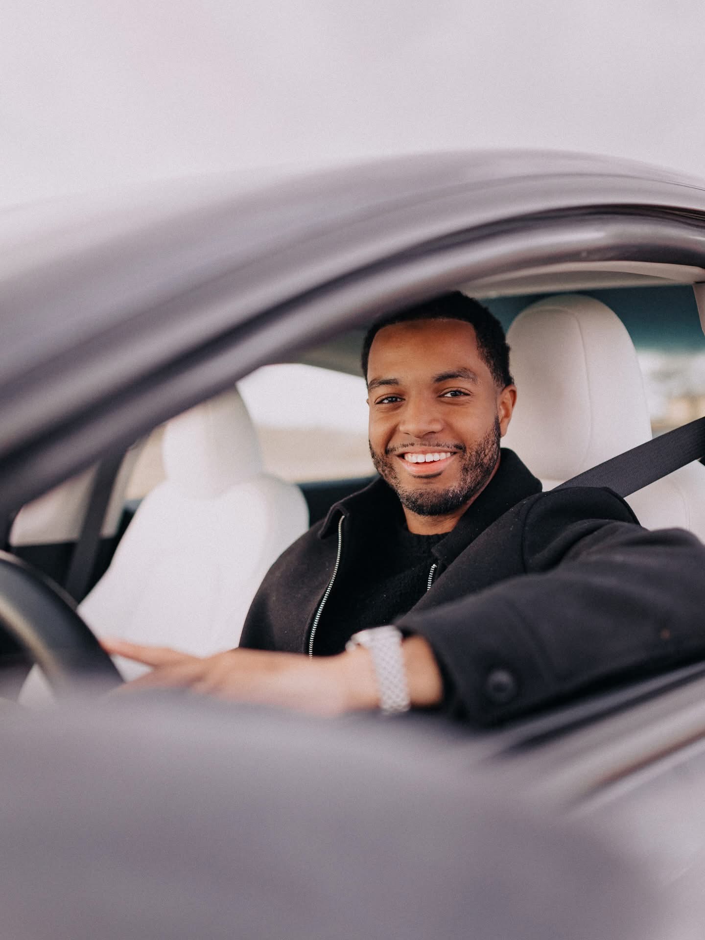 Davon Lee smiling behind the wheel