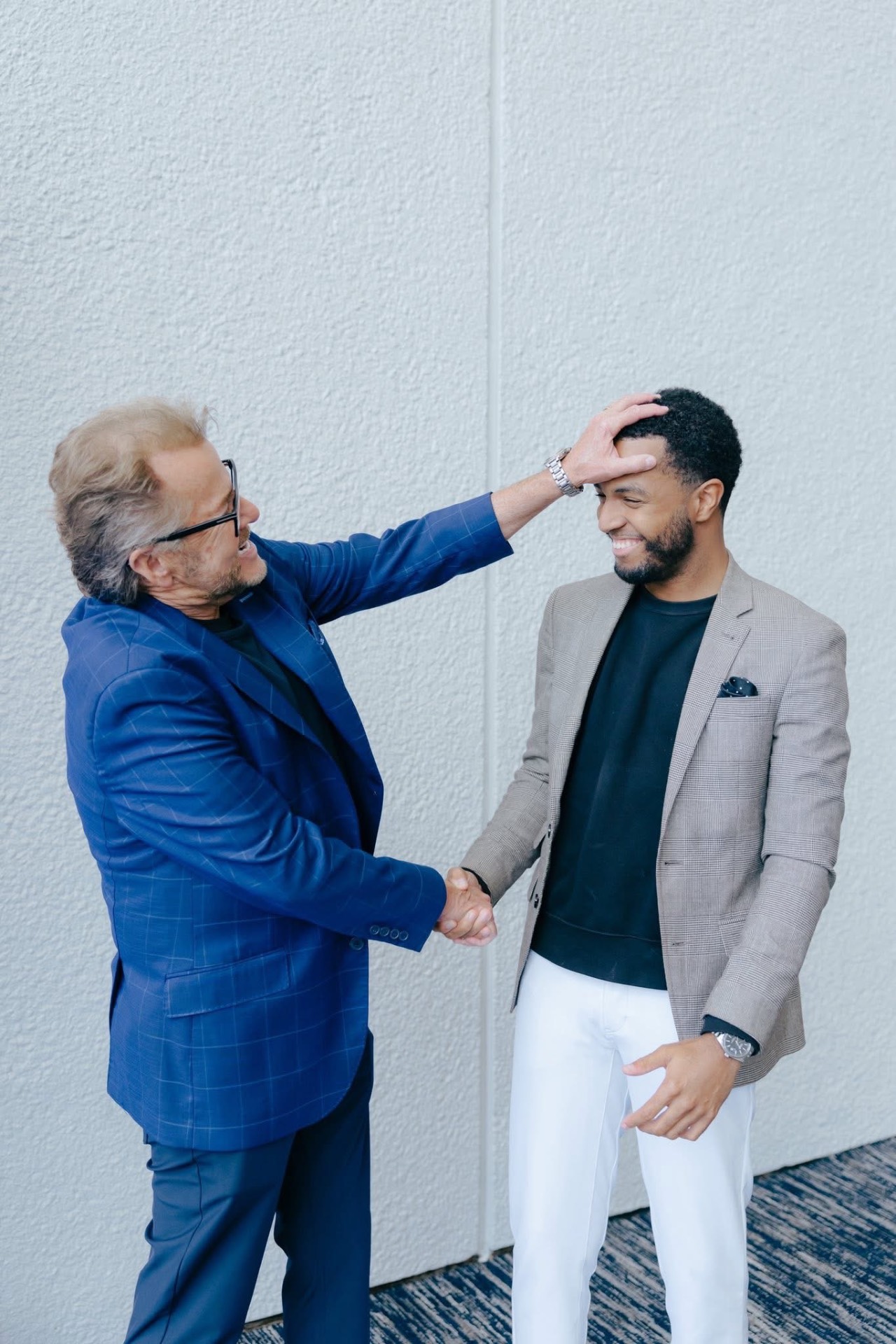 A ministry mentor praying a blessing over Davon